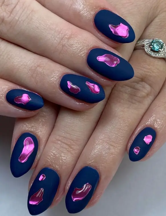 Matte velvet dark blue nails with pink chrome water droplets
