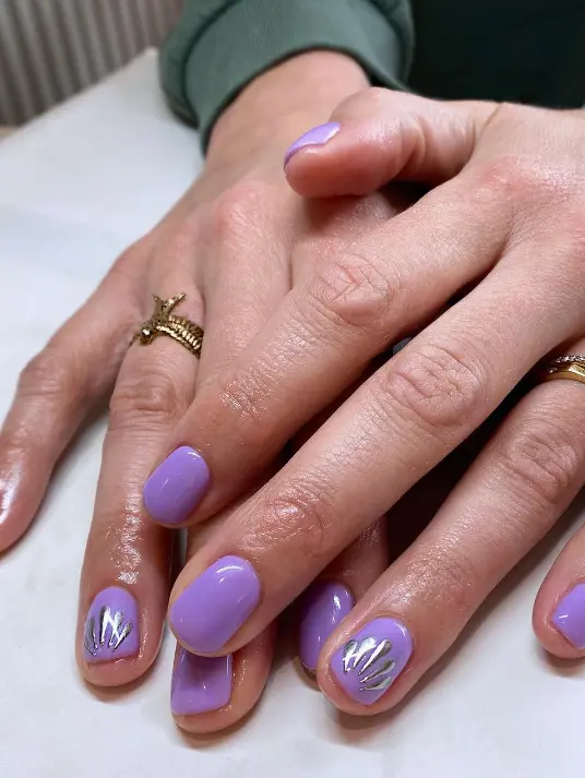 Lavender Parma Violet nails with silver chrome shell details
