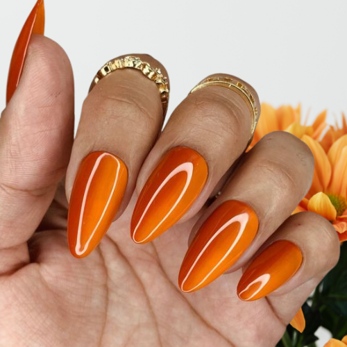 Orange chrome nails